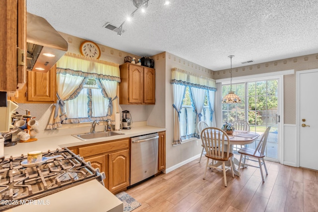 44 Sacramento Way, Tinton Falls, NJ 07712 - kitchen featuring dishwasher, ventilation hood, a textured ceiling, light countertops, and light wood-style floors