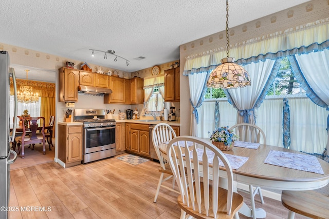 44 Sacramento Way, Tinton Falls, NJ 07712 - kitchen featuring appliances with stainless steel finishes, a chandelier, under cabinet range hood, light countertops, and a textured ceiling
