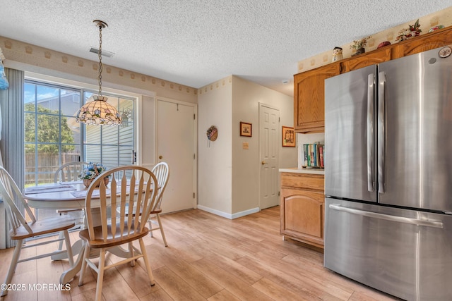 44 Sacramento Way, Tinton Falls, NJ 07712 - dining area featuring a textured ceiling and light wood finished floors