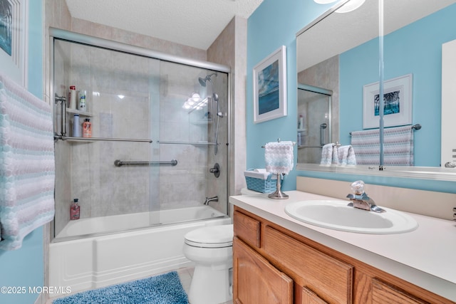 44 Sacramento Way, Tinton Falls, NJ 07712 - full bath with vanity, enclosed tub / shower combo, tile patterned floors, and a textured ceiling