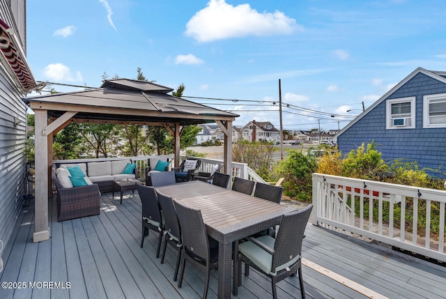 deck with a gazebo and an outdoor living space