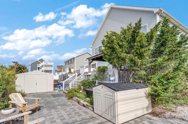 exterior space with a storage unit and an outdoor structure