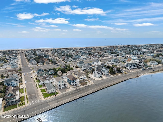 birds eye view of property featuring a residential view and a water view