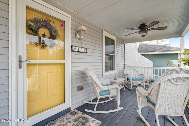 deck featuring a ceiling fan and a porch