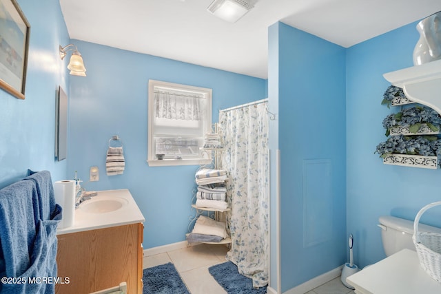 full bathroom featuring a shower with curtain, vanity, baseboards, tile patterned floors, and toilet