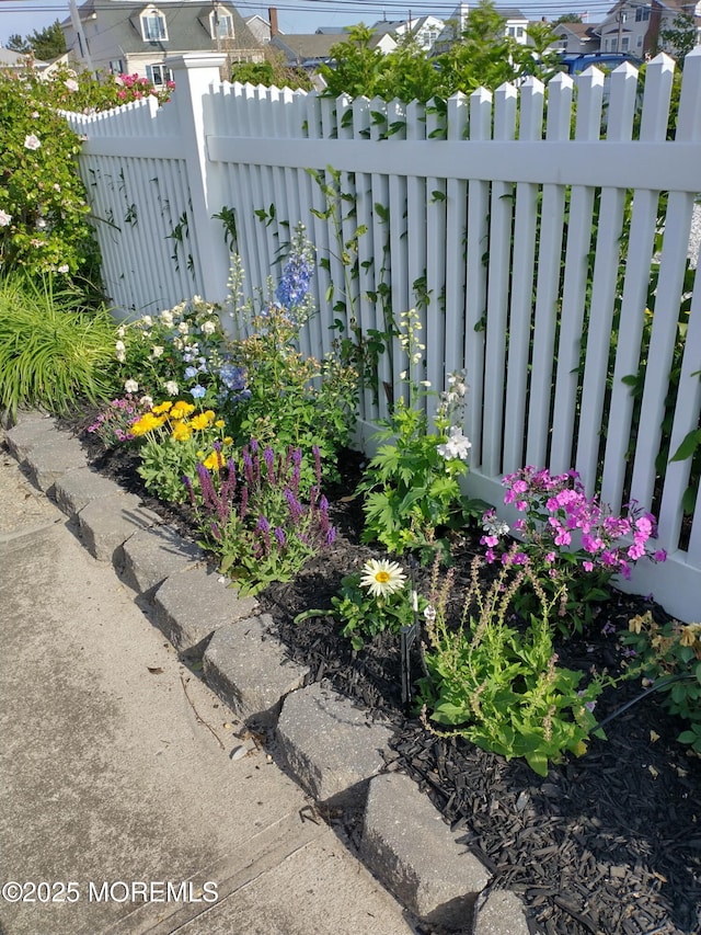 exterior details with fence and a residential view