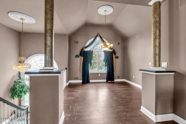 additional living space featuring ornate columns, dark wood finished floors, lofted ceiling, and visible vents