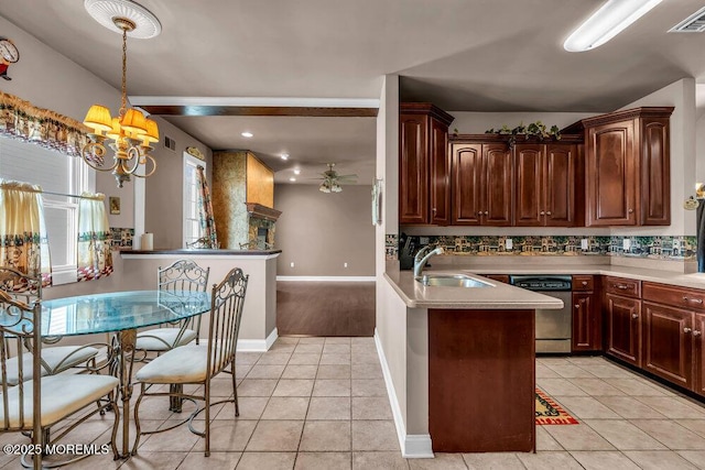 kitchen featuring stainless steel dishwasher, visible vents, light tile patterned flooring, a sink, and ceiling fan with notable chandelier