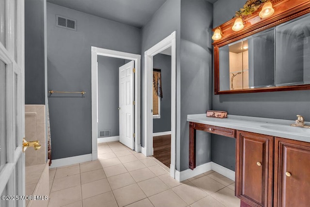 bathroom featuring tile patterned floors, visible vents, and vanity