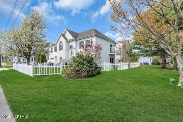 view of side of home featuring a lawn and fence private yard