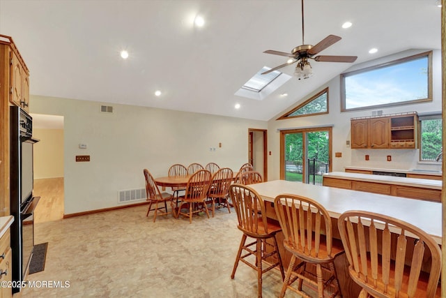 159 Koster Dr, Freehold, NJ 07728 - dining area with plenty of natural light, ceiling fan, recessed lighting, high vaulted ceiling, and a skylight