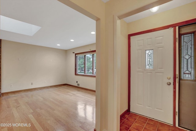 159 Koster Dr, Freehold, NJ 07728 - entrance foyer featuring a skylight, wood finished floors, and baseboards