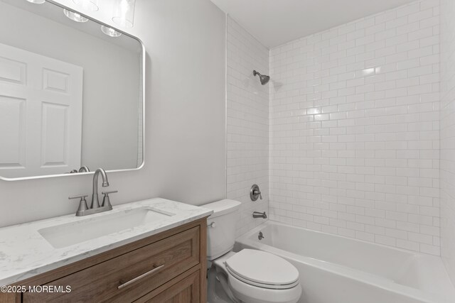 bathroom with toilet, bathtub / shower combination, and vanity