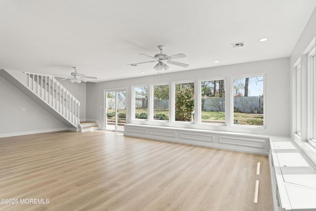 unfurnished living room featuring visible vents, stairway, ceiling fan, and recessed lighting