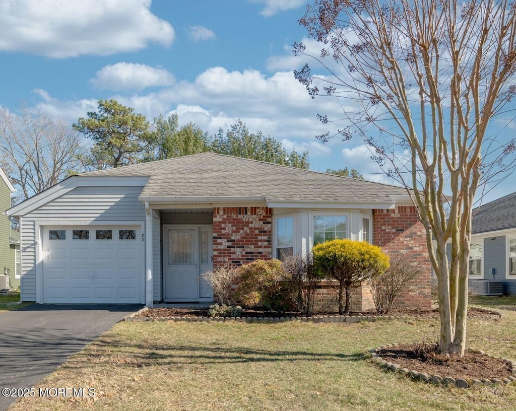 22 Pine Oak Blvd, Barnegat, NJ 08005 - ranch-style home featuring driveway, a garage, brick siding, a front lawn, and a shingled roof