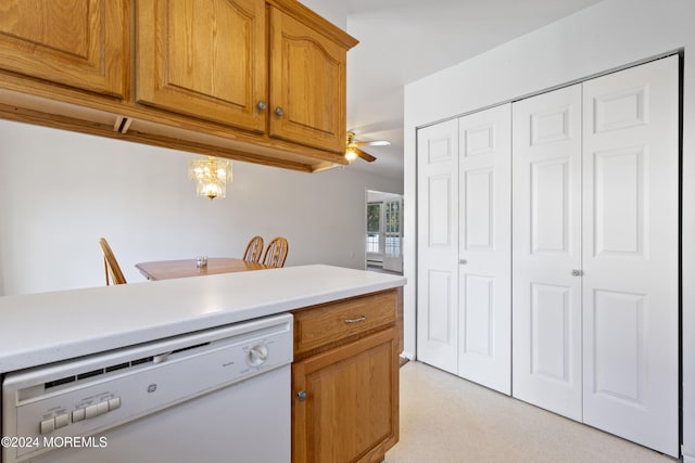 kitchen with brown cabinetry, ceiling fan, white dishwasher, and light countertops
