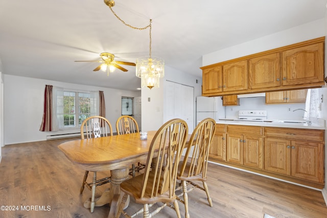 dining space with light wood-type flooring, a ceiling fan, and baseboard heating