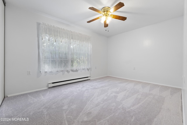 carpeted spare room featuring a baseboard heating unit, baseboards, and ceiling fan