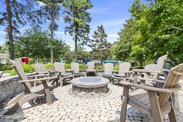 view of patio featuring an outdoor fire pit