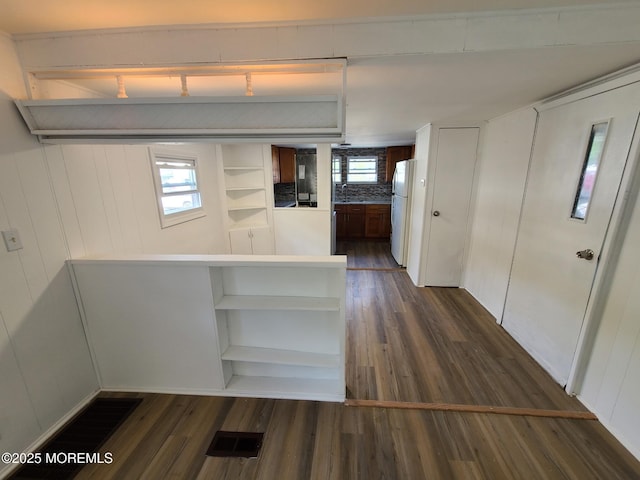 28 Alissa Ter, Jackson, NJ 08527 - interior space with dark wood-style flooring, open shelves, a peninsula, and freestanding refrigerator