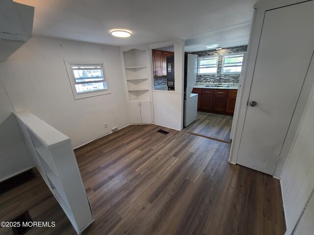 28 Alissa Ter, Jackson, NJ 08527 - unfurnished dining area featuring visible vents, a wealth of natural light, a sink, and dark wood-type flooring