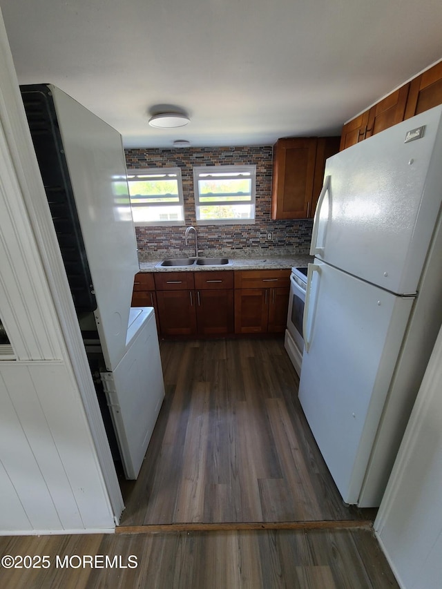 28 Alissa Ter, Jackson, NJ 08527 - kitchen featuring dark wood-style flooring, white appliances, brown cabinets, a sink, and backsplash