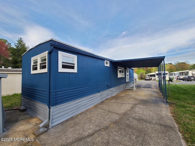 28 Alissa Ter, Jackson, NJ 08527 - view of home's exterior with driveway and a carport