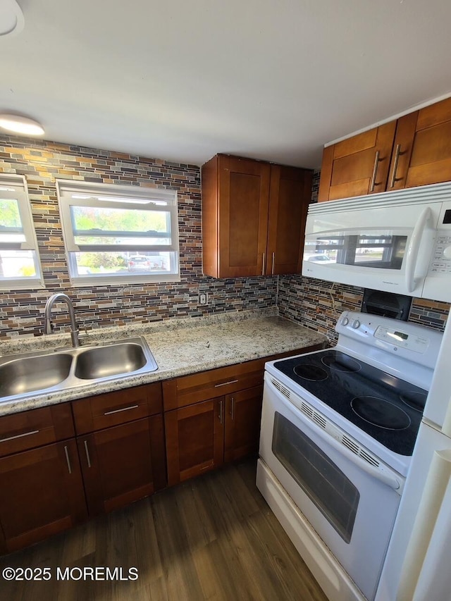 28 Alissa Ter, Jackson, NJ 08527 - kitchen with dark wood-type flooring, a sink, decorative backsplash, and white appliances