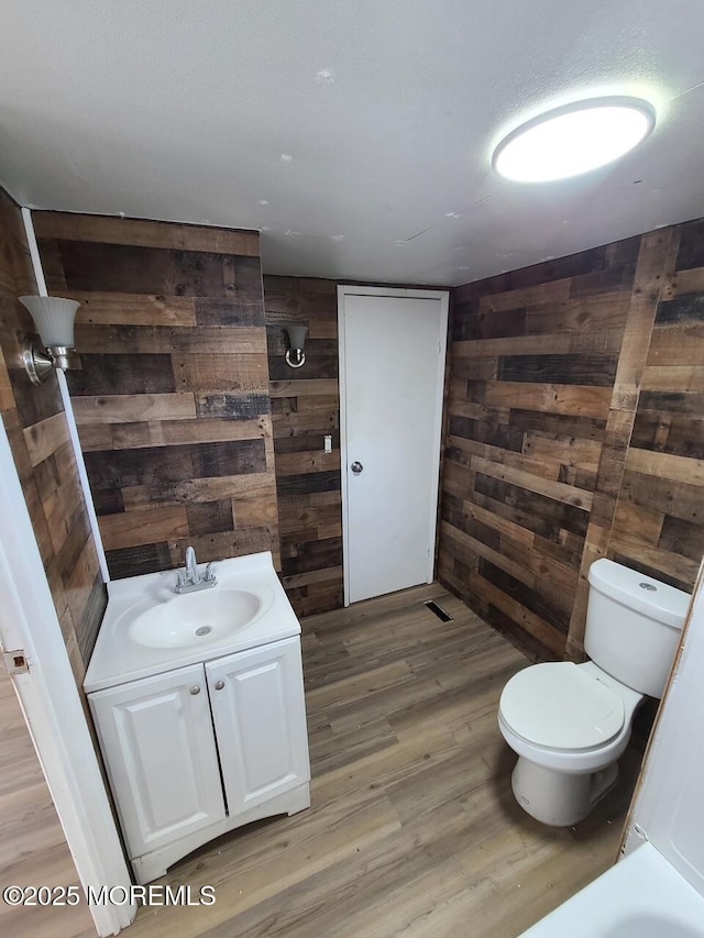 28 Alissa Ter, Jackson, NJ 08527 - bathroom with toilet, wood walls, wood finished floors, and vanity