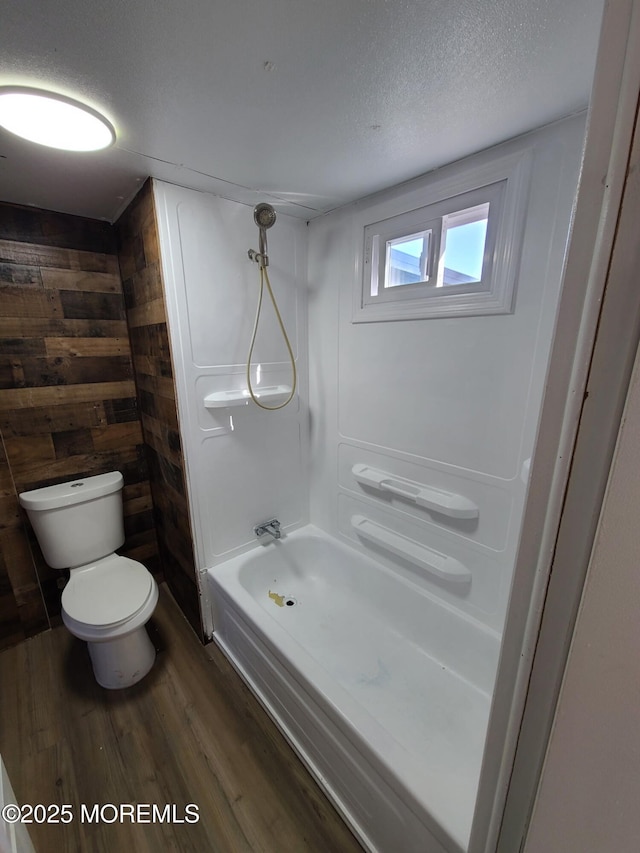 28 Alissa Ter, Jackson, NJ 08527 - full bathroom featuring toilet, a textured ceiling, wood finished floors, and bathtub / shower combination
