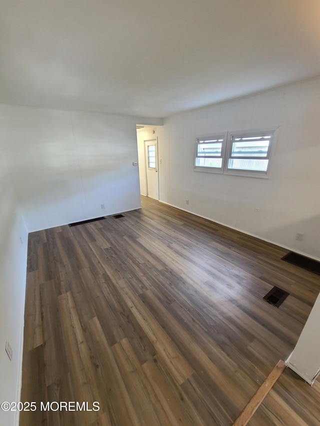 28 Alissa Ter, Jackson, NJ 08527 - unfurnished living room featuring dark wood finished floors and visible vents