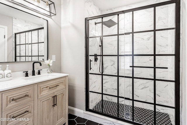full bathroom with vanity, a stall shower, and tile patterned floors