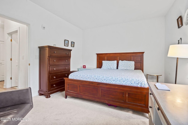 bedroom featuring light carpet