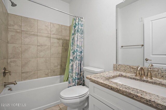 bathroom with vanity, tile patterned flooring, toilet, and shower / tub combo