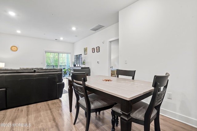 dining area featuring light wood-style floors, recessed lighting, and visible vents