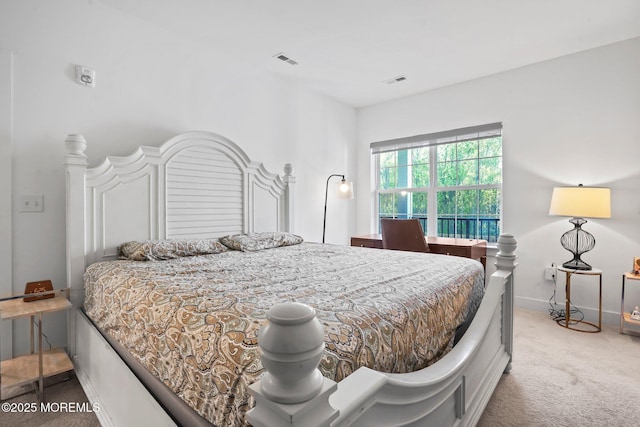bedroom with carpet flooring, baseboards, and visible vents