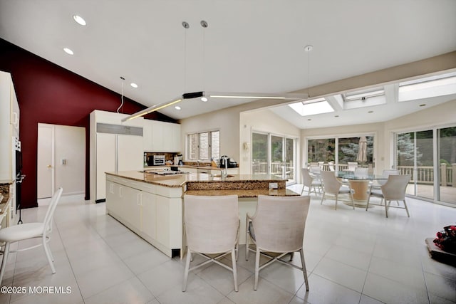 44 Nikki Ct, Morganville, NJ 07751 - kitchen featuring recessed lighting, light stone countertops, modern cabinets, white cabinetry, and white appliances