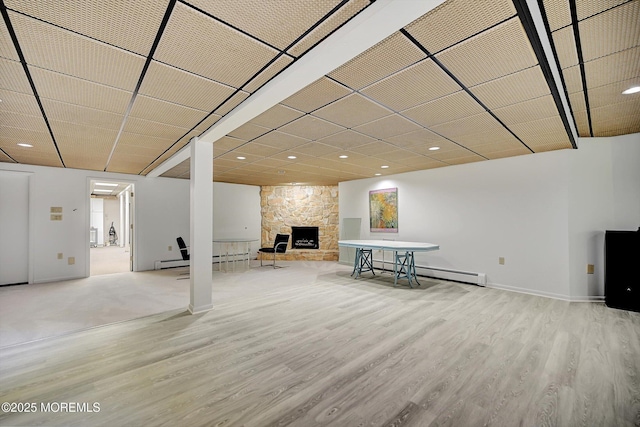 44 Nikki Ct, Morganville, NJ 07751 - basement featuring baseboards, recessed lighting, wood finished floors, and a fireplace