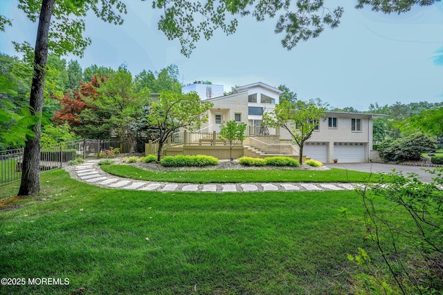 44 Nikki Ct, Morganville, NJ 07751 - view of yard featuring a garage, fence, and driveway