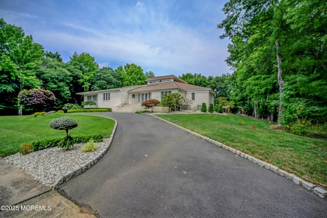 44 Nikki Ct, Morganville, NJ 07751 - single story home with a front yard and aphalt driveway