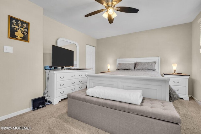 bedroom featuring baseboards, a ceiling fan, and light colored carpet