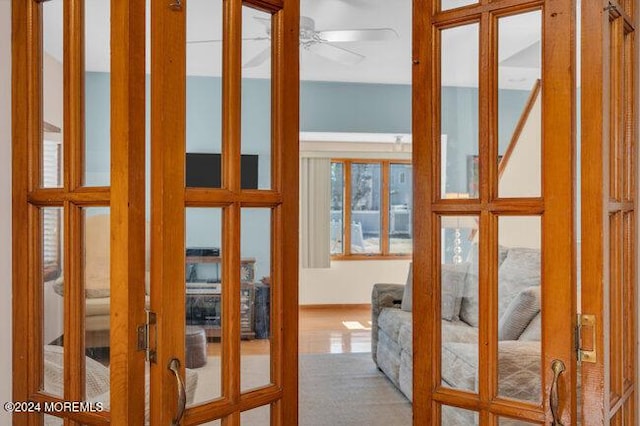 entryway with a ceiling fan and french doors