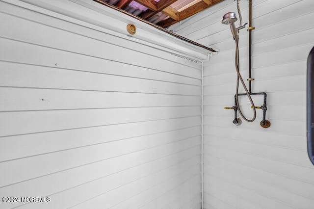bathroom with tiled shower