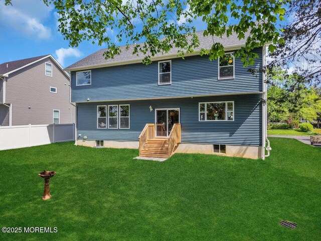 136 Lilac Dr, Brick, NJ 08724 - rear view of house with a lawn and fence