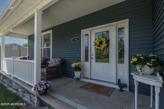 136 Lilac Dr, Brick, NJ 08724 - view of exterior entry with a porch