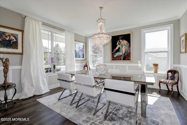 136 Lilac Dr, Brick, NJ 08724 - dining space featuring crown molding, a notable chandelier, a healthy amount of sunlight, and dark wood finished floors