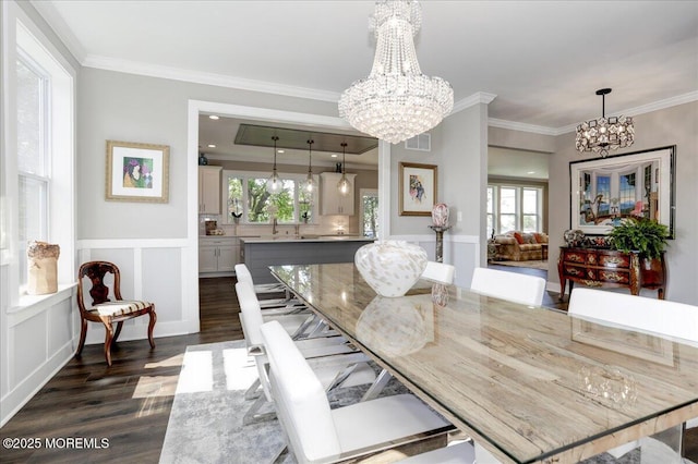 136 Lilac Dr, Brick, NJ 08724 - dining area with an inviting chandelier, wainscoting, dark wood finished floors, visible vents, and ornamental molding
