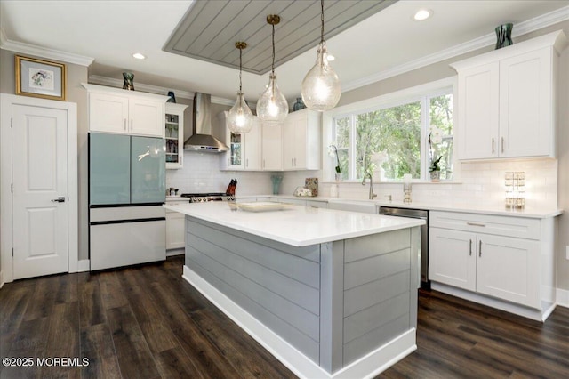 136 Lilac Dr, Brick, NJ 08724 - kitchen with wall chimney range hood, crown molding, appliances with stainless steel finishes, and white cabinets