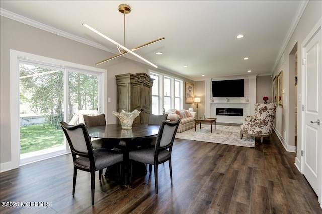 136 Lilac Dr, Brick, NJ 08724 - dining area featuring crown molding, recessed lighting, dark wood finished floors, and a healthy amount of sunlight