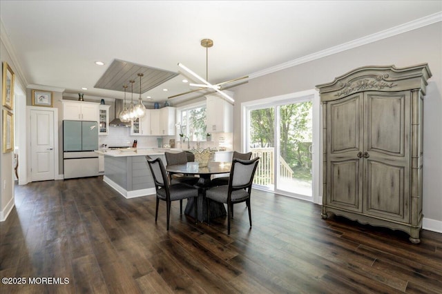 136 Lilac Dr, Brick, NJ 08724 - dining room with crown molding, dark wood-style flooring, and a notable chandelier